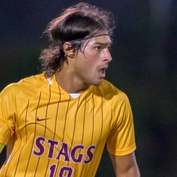 Jacob Lockman in the maroon and gold Stags kit