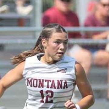Lucie Rokos running in the Montana kit